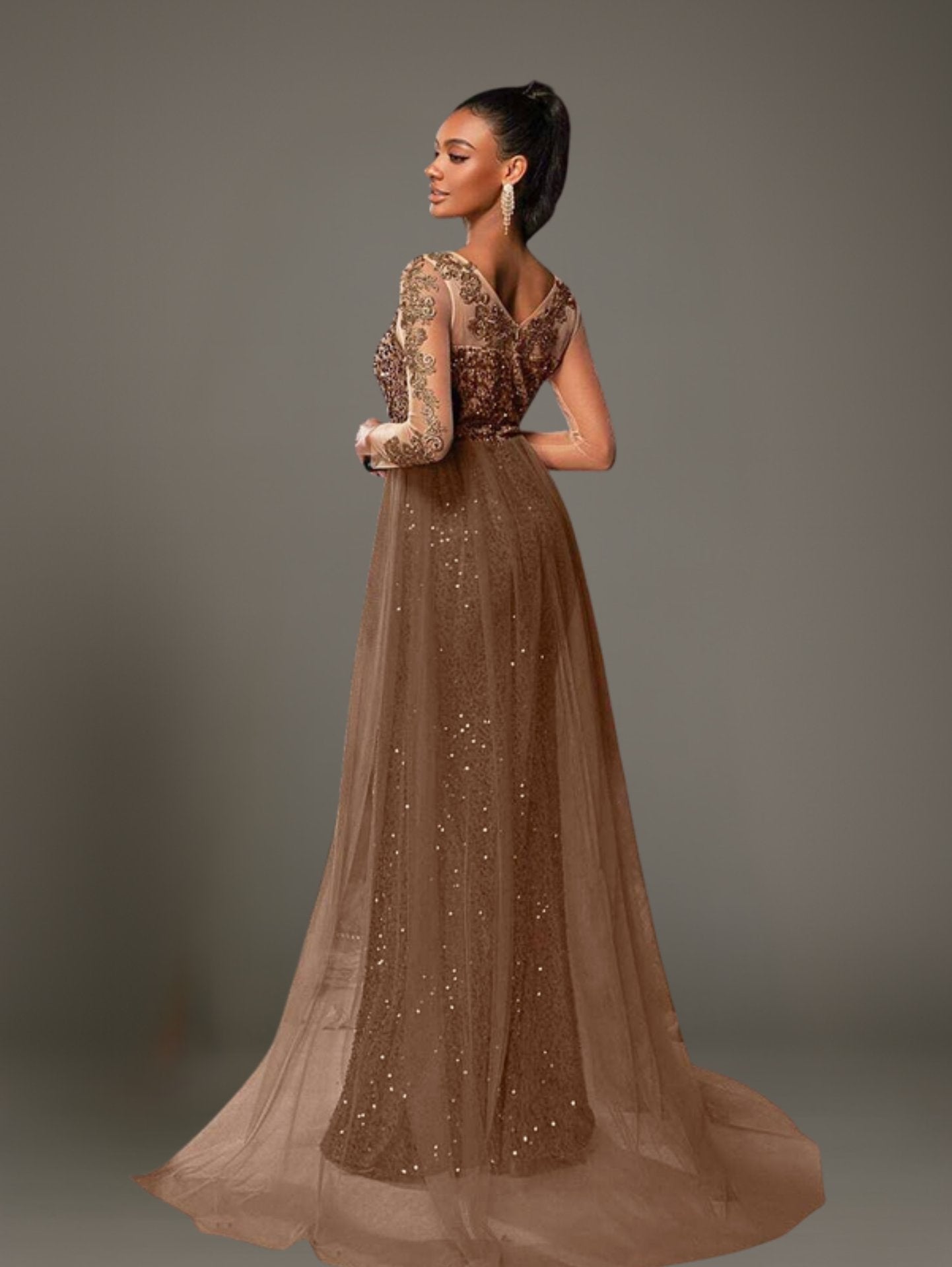 Back view of brown sequin mermaid dress featuring V back and sheer tulle overlay.