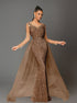 Woman wearing a brown long, elegant sequin mermaid dress on a gray background