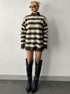 oversized brown striped quarter zip sweater styled with black boots