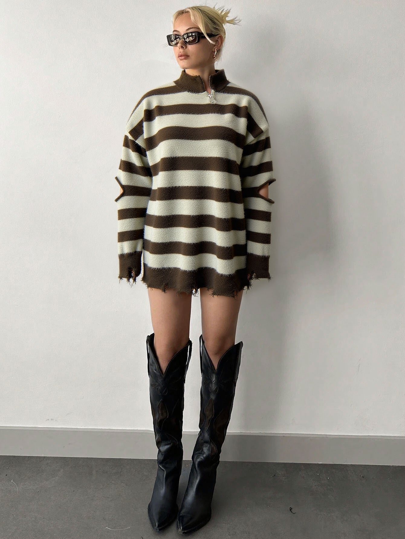 oversized brown striped quarter zip sweater styled with black boots