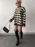 model wearing brown striped quarter zip sweater with knee boots in streetwear look