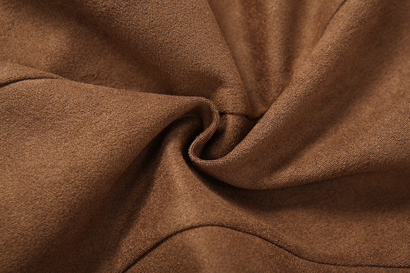 Close-up of brown fabric with folds