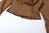 close-up of brown suede fabric showing texture and stretch