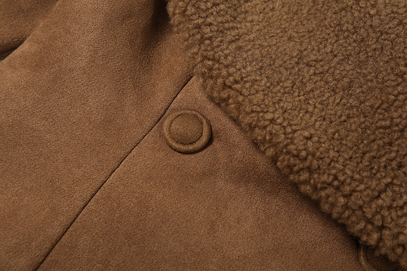 close-up of brown suede jacket double-button detail