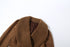 close-up of brown suede jacket fur collar on white background