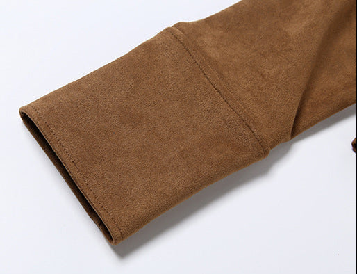 close-up of brown suede jacket sleeve on white background