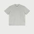 Light heather gray oversized t-shirt displayed flat against light gray background with branded tag visible