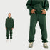 Model wearing charcoal gray hoodie and joggers with white undershirt and beige Jordan sneakers in split-view format