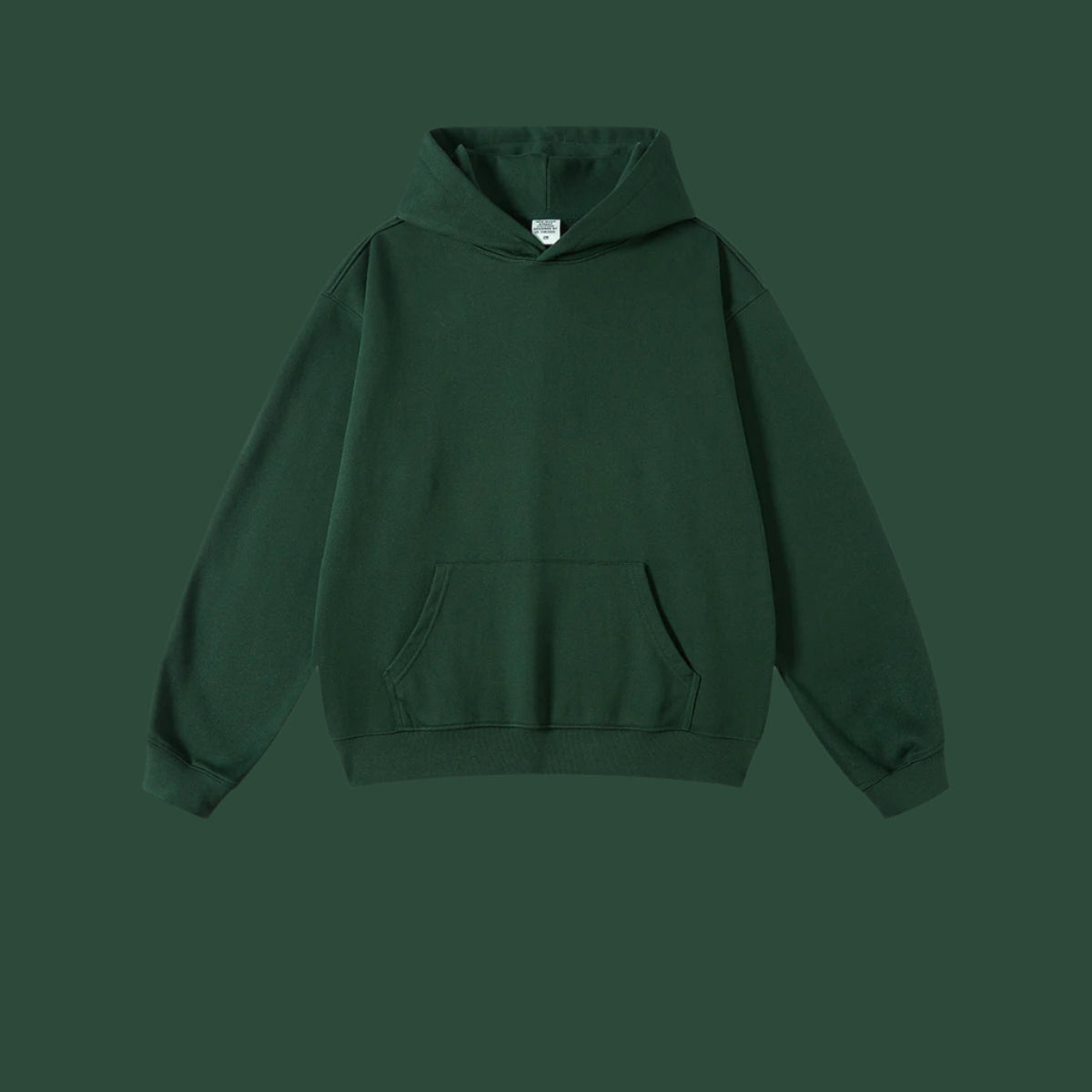Forest green hoodie with front pocket and ribbed cuffs on matching background