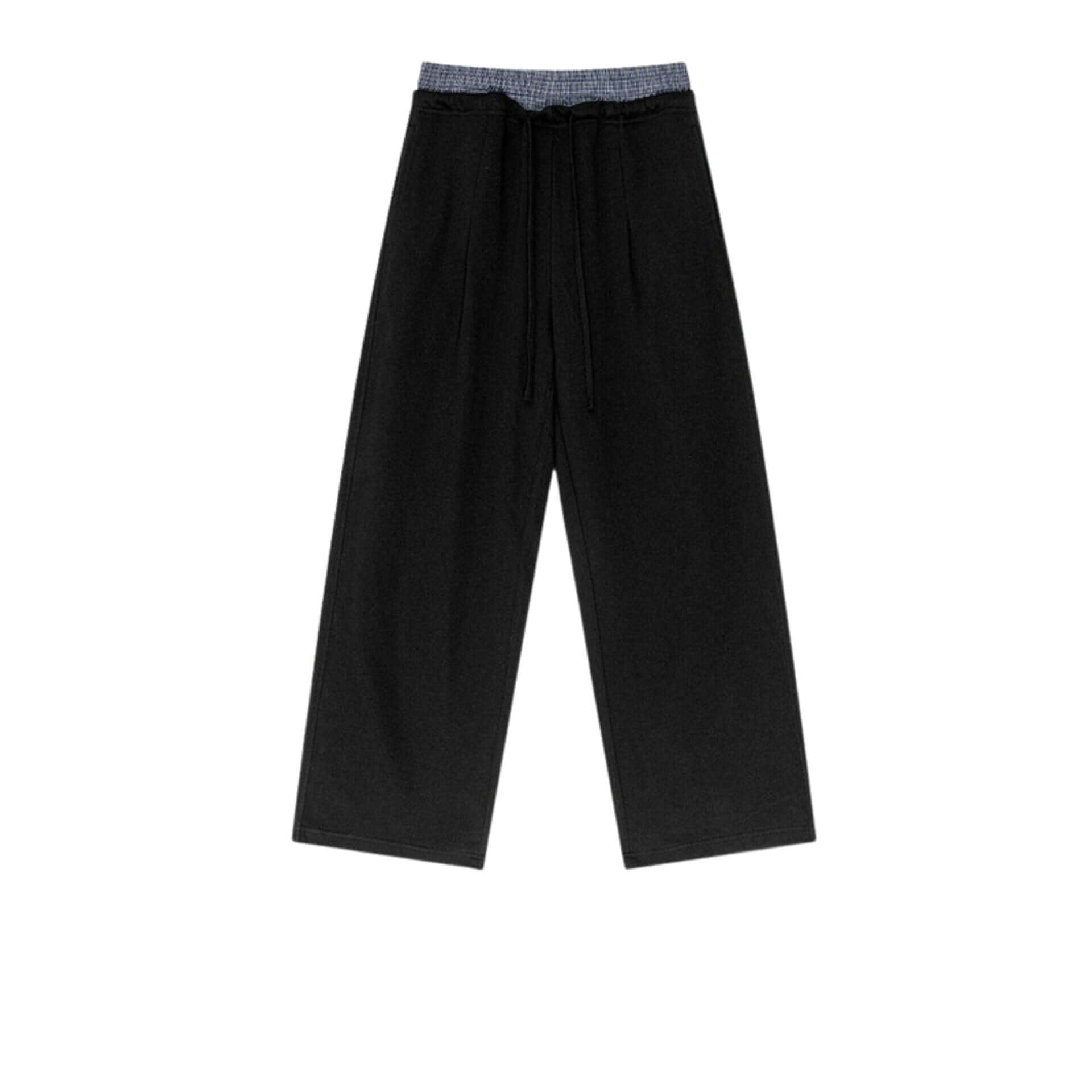 Black wide-leg sweatpants with an elastic waistband and drawstring, laid flat on a neutral textured background.