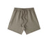 Light gray cotton shorts with elastic waistband and drawstring ties, displayed flat against white background