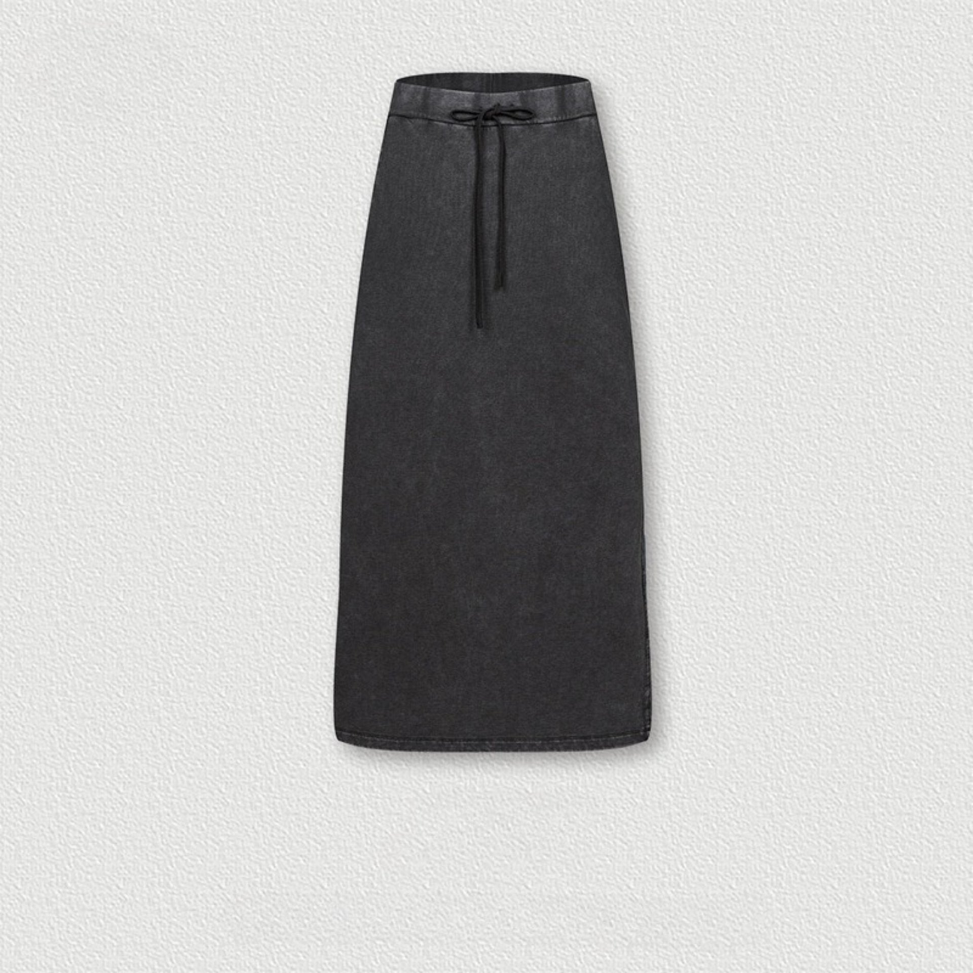 Black long denim skirt with drawstring waist, featuring soft washed texture and subtle side seam detail