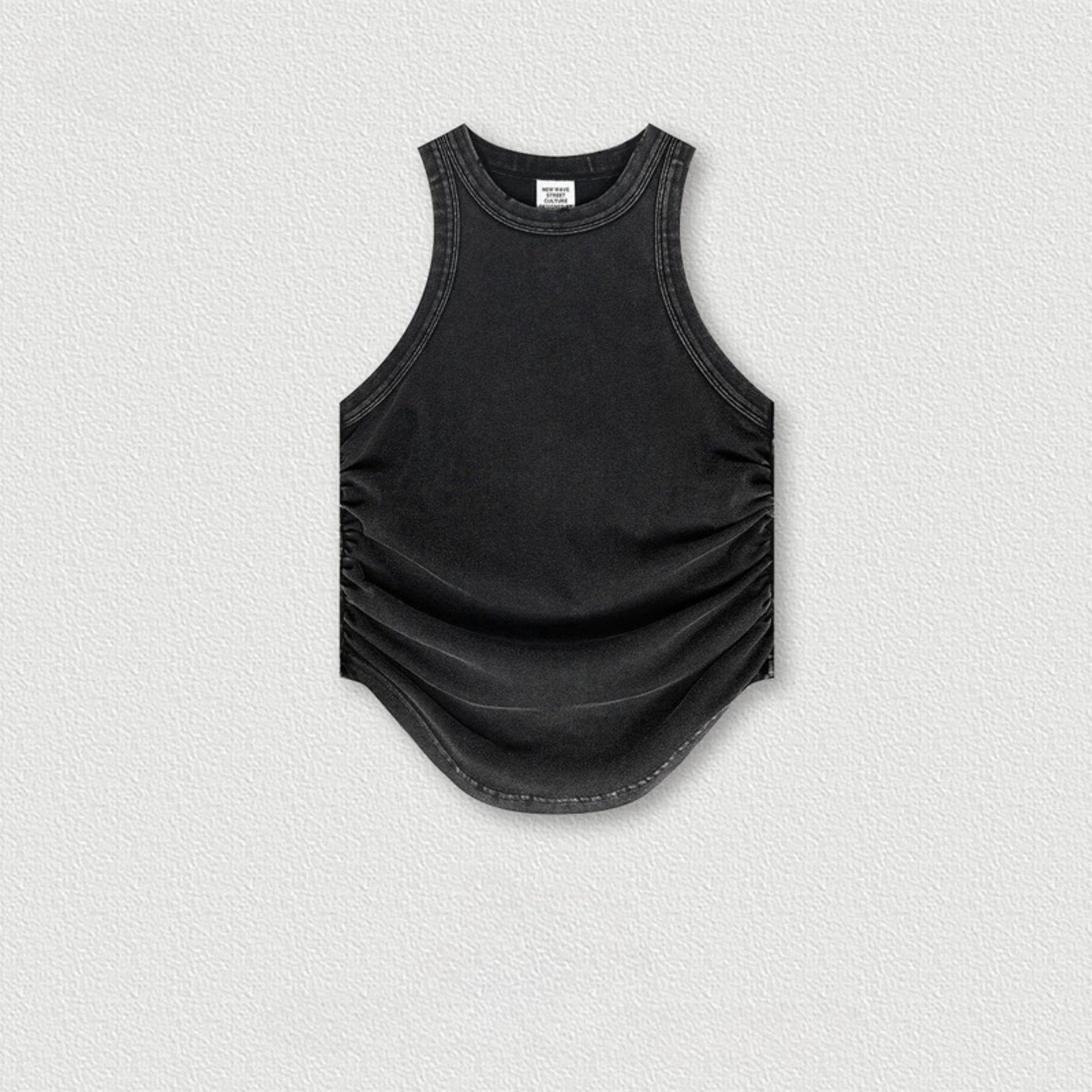 Black sleeveless top with side ruching and curved hem, flat product shot