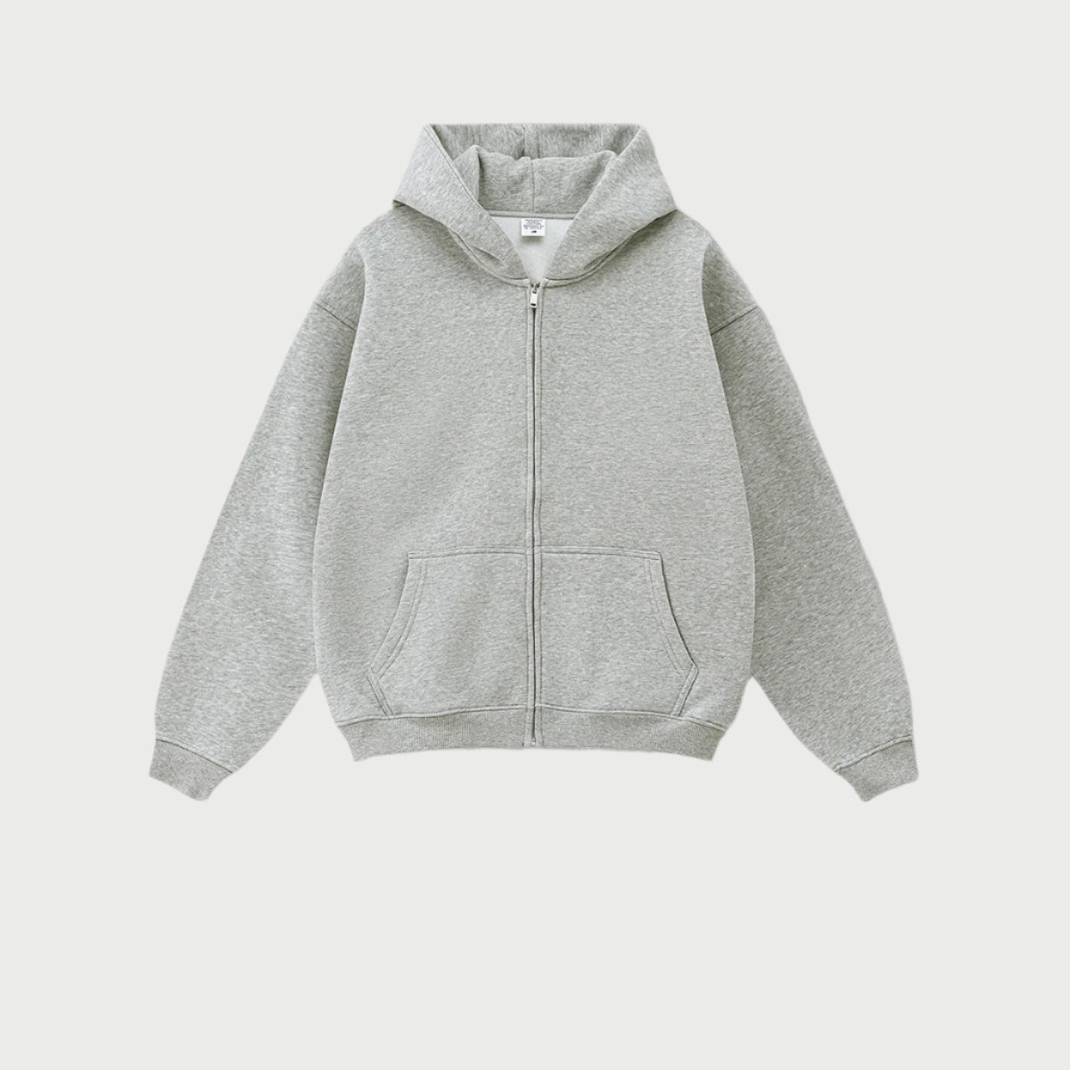 Heather gray oversized zip-up hoodie with front kangaroo pocket and ribbed cuffs displayed on light gray background