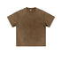 Product shot of brown mineral-washed oversized t-shirt with crew neck and short sleeves on plain background