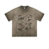 Front view of washed taupe oversized t-shirt with graffiti print against white background