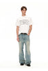 Front styling view of white chain graphic T-shirt paired with relaxed denim