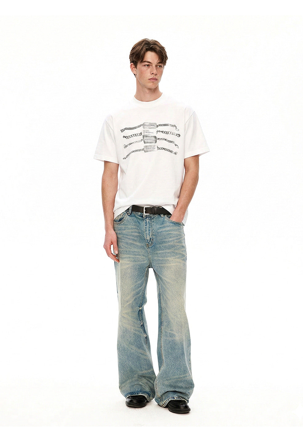 Front styling view of white chain graphic T-shirt paired with relaxed denim