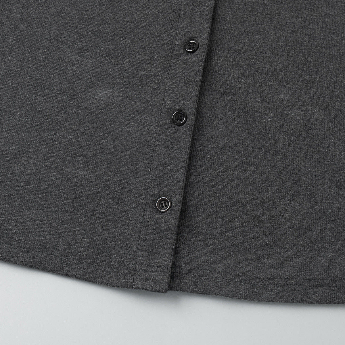 close-up of charcoal ribbed cardigan front button placket
