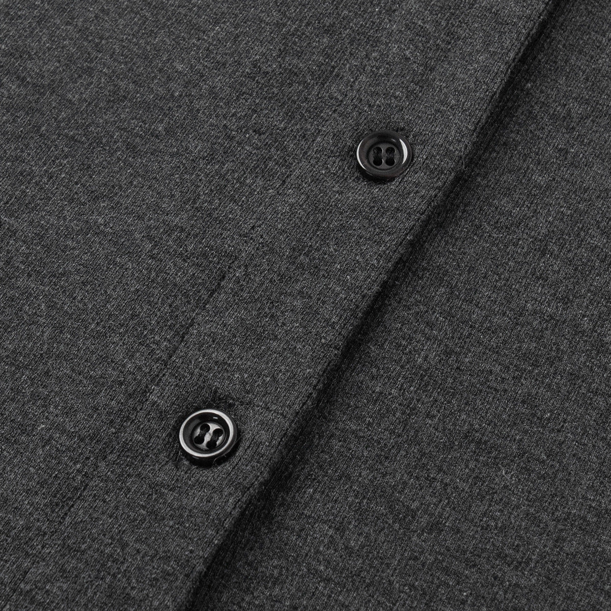 Close-up of charcoal gray's buttons detail 