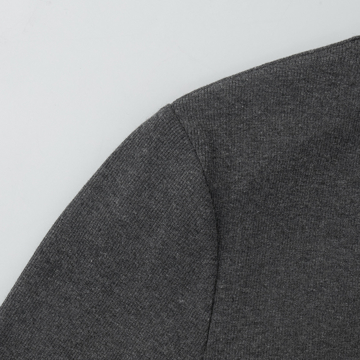 close-up of charcoal ribbed cardigan shoulder seam
