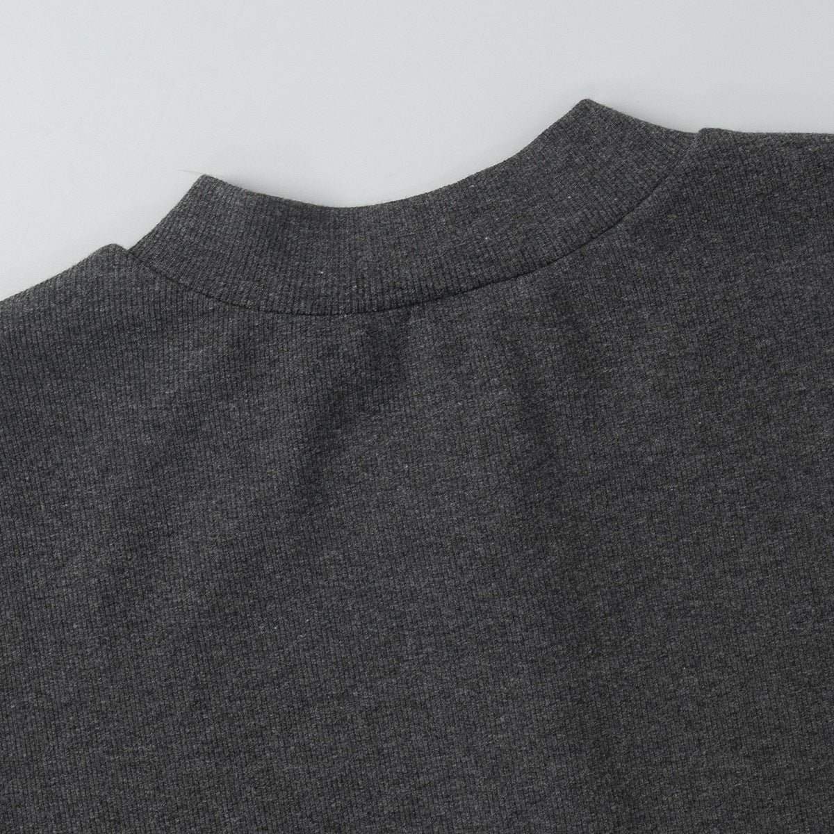 back view of charcoal ribbed crop cardigan laid flat