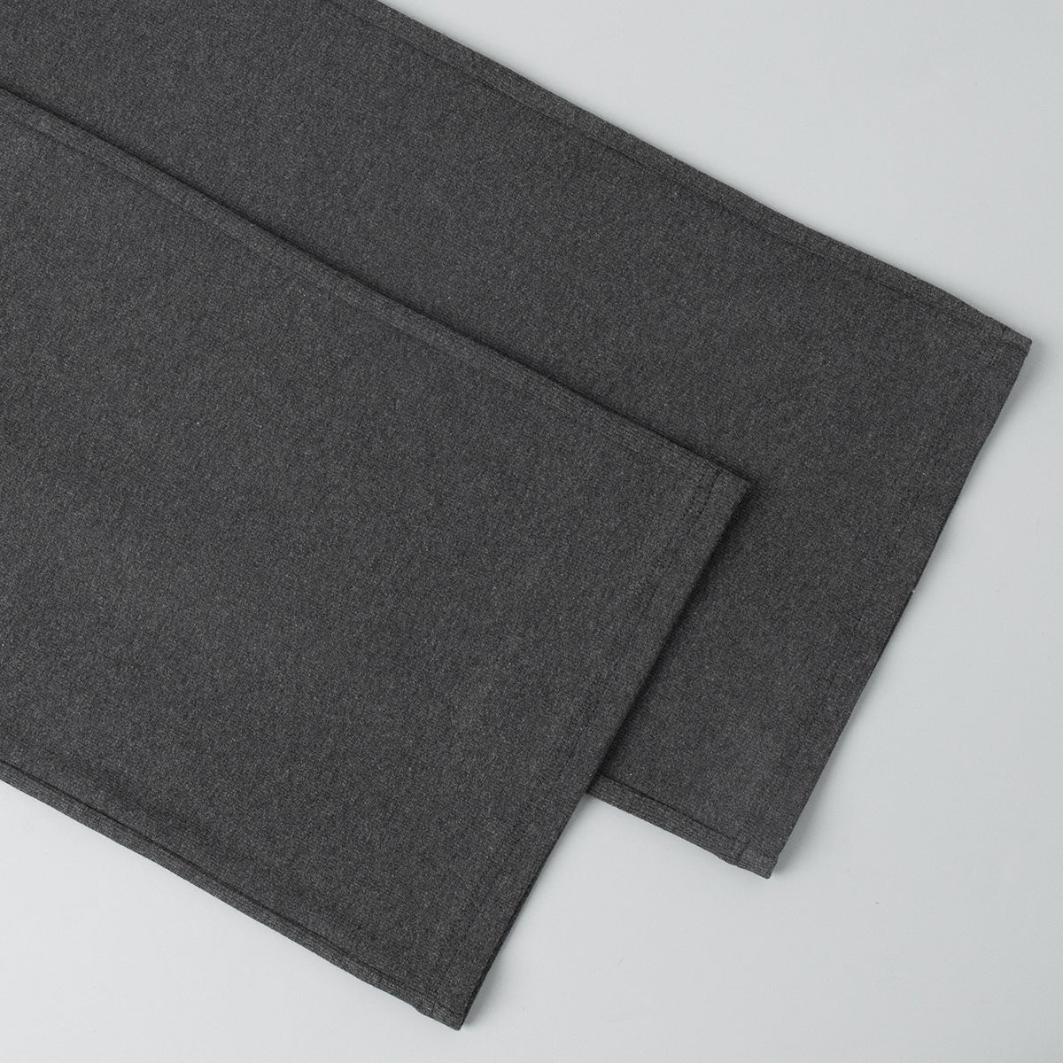 close-up of charcoal ribbed pants hem detail