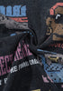 Twisted close-up of black cotton tee fabric with pixel print