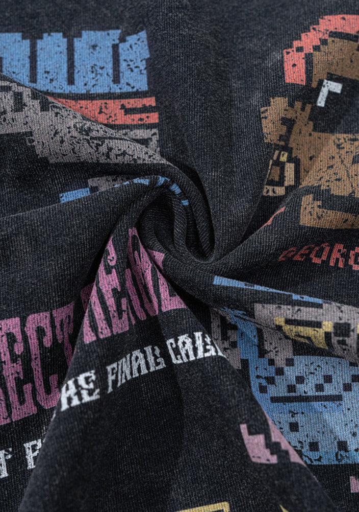 Twisted close-up of black cotton tee fabric with pixel print