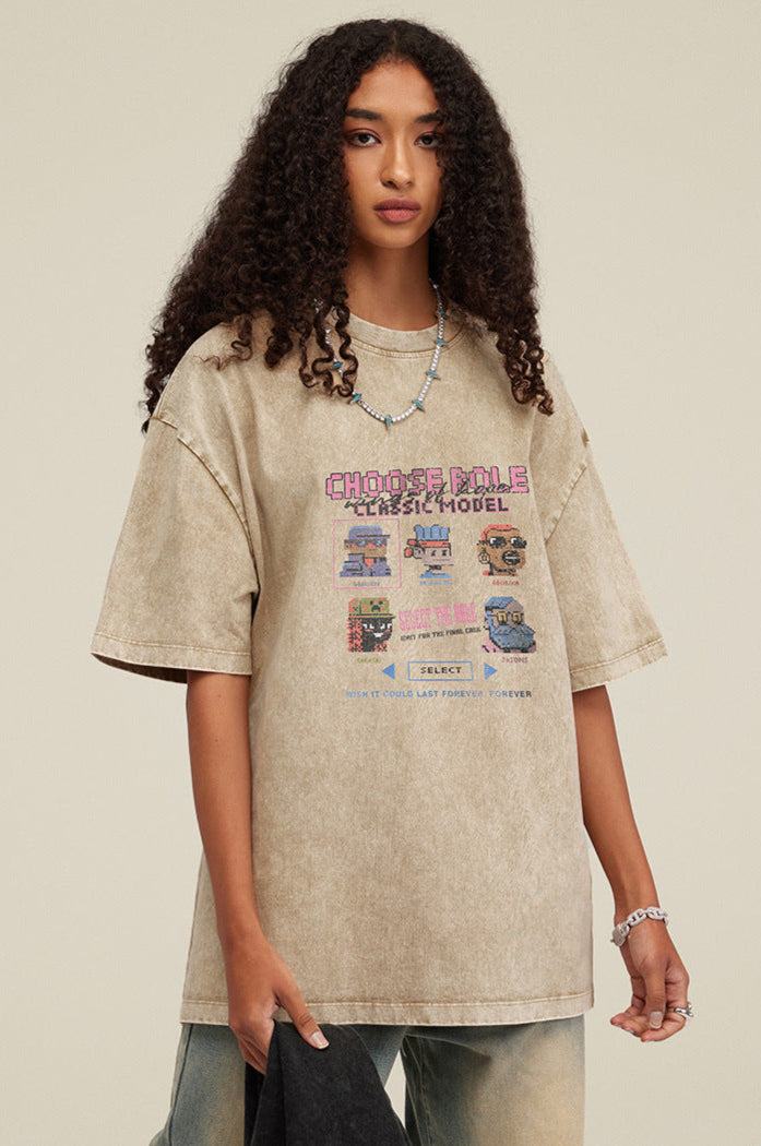 Woman in khaki Choose Role tee holding black tee in hand