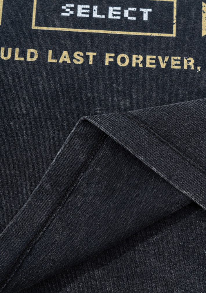 Folded hem of black pixel tee with SELECT button graphic