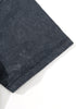 Close-up of black tee sleeve showing neat double stitching