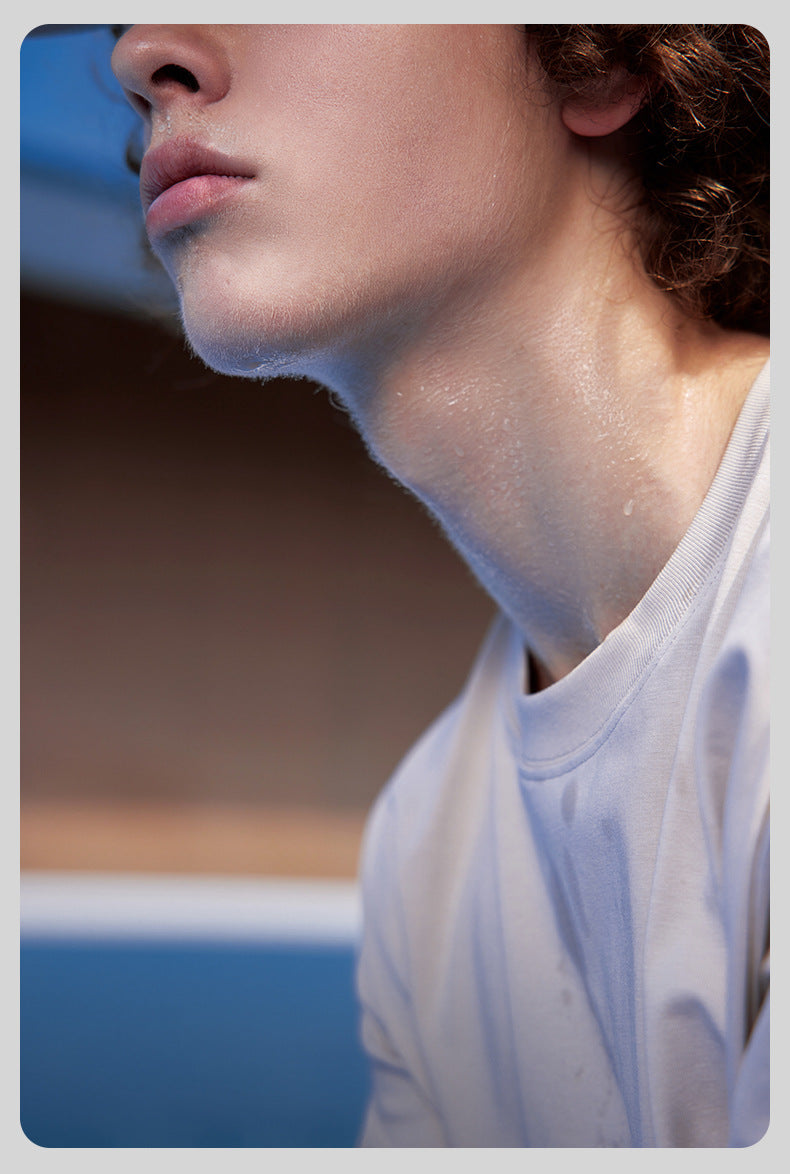 Close-up of unisex t-shirt collar in purple, breathable cotton fabric