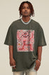 Front close-up of model wearing olive green tee with red skeleton and flowers.