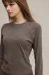 Close-up neckline of coffee brown women’s long sleeve tee