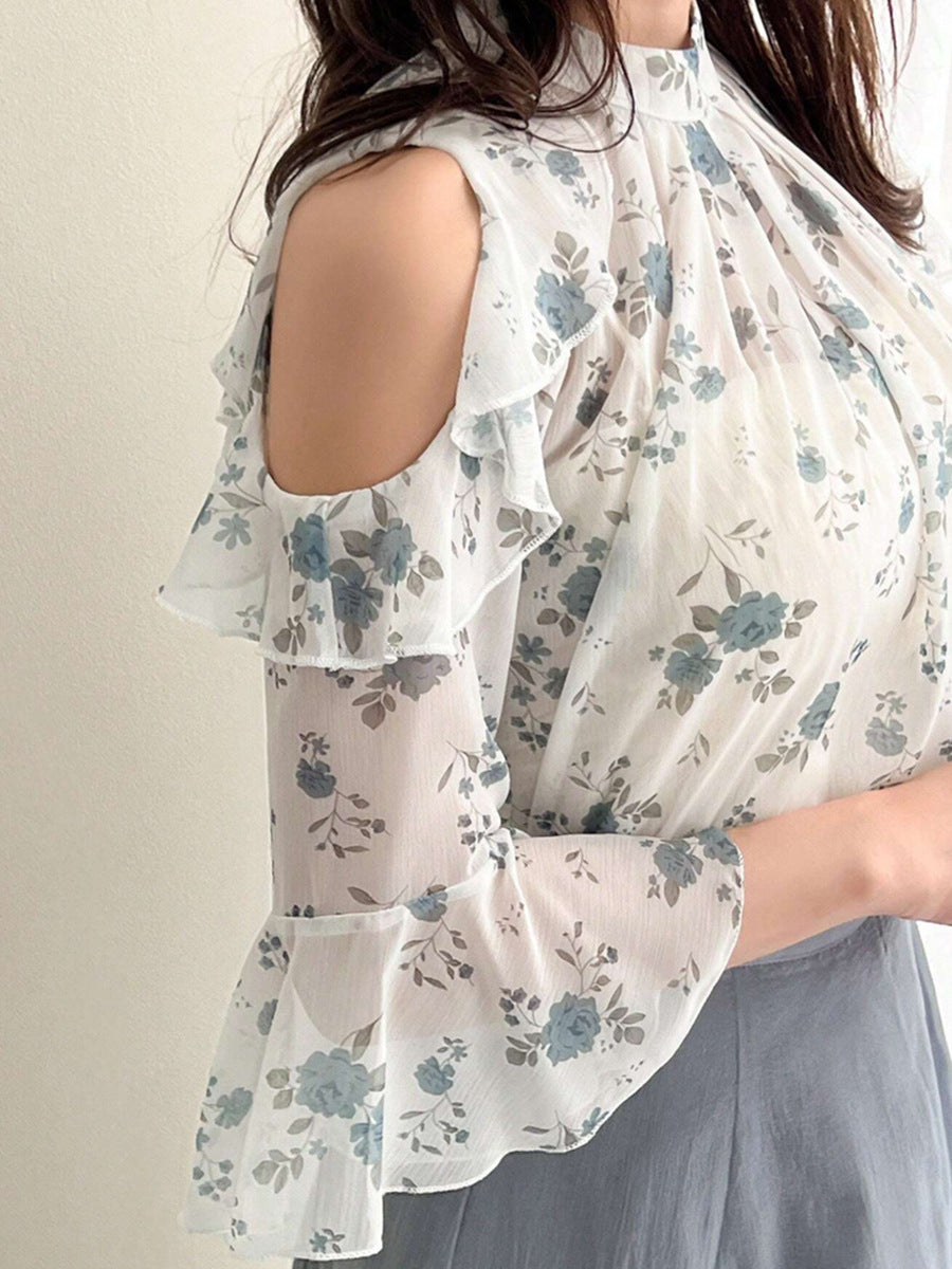 Side angle of floral cold shoulder top with ruffle details
