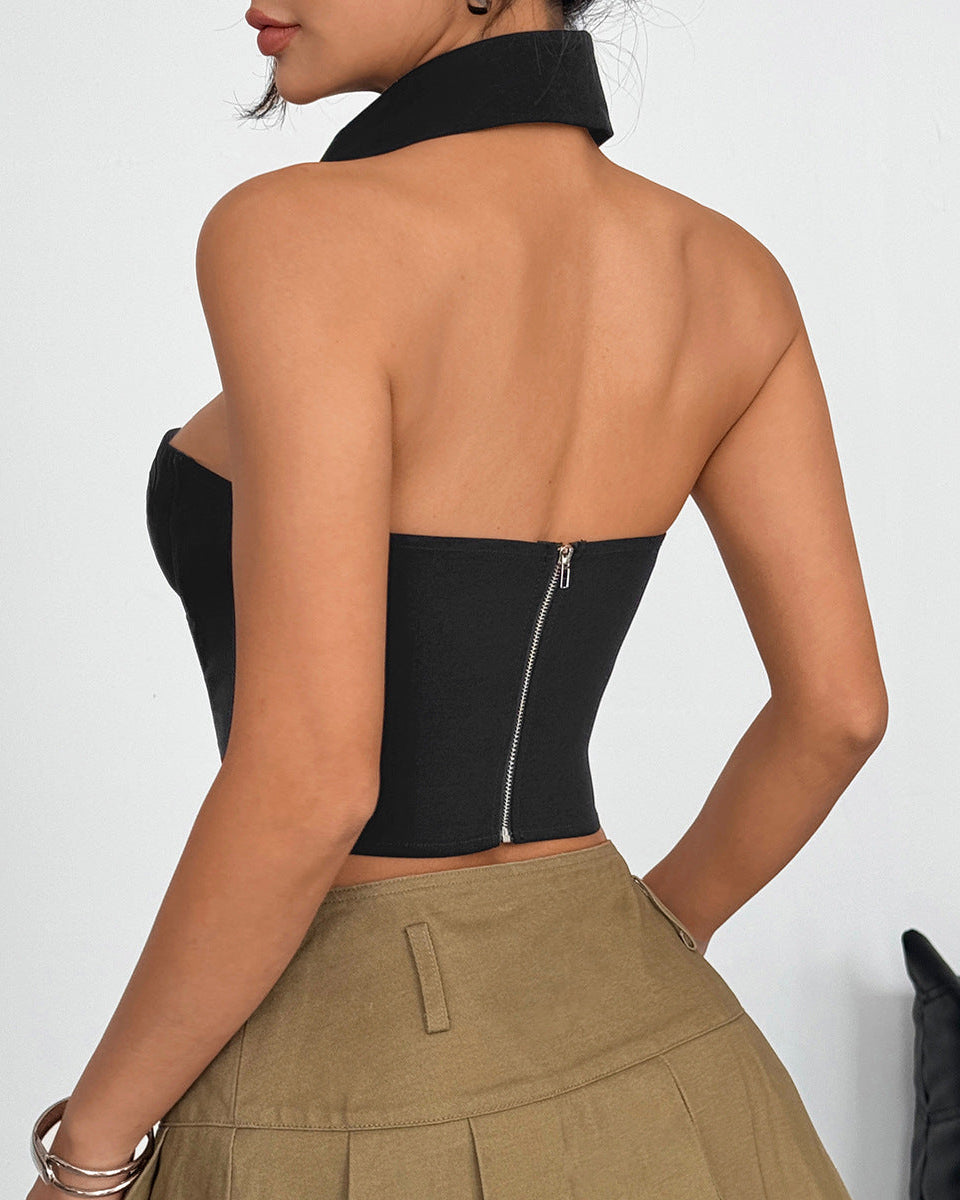 Back view of black strapless corset top with zip closure and halter collar.