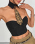 Close-up of black bustier crop top with leopard print tie and pointed collar.