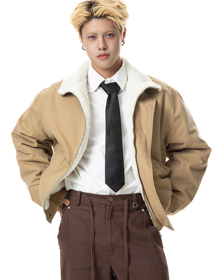 Medium shot of khaki cotton jacket worn open showing plush white lining and relaxed shoulders.