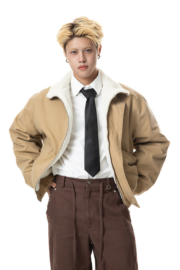 Medium shot of khaki cotton jacket worn open showing plush white lining and relaxed shoulders.