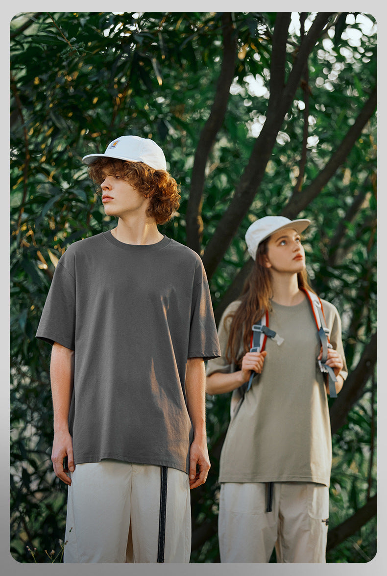 Couple wearing unisex oversized cotton tees outdoors
