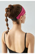 Back view of woman wearing cranberry headband with black elastic band.
