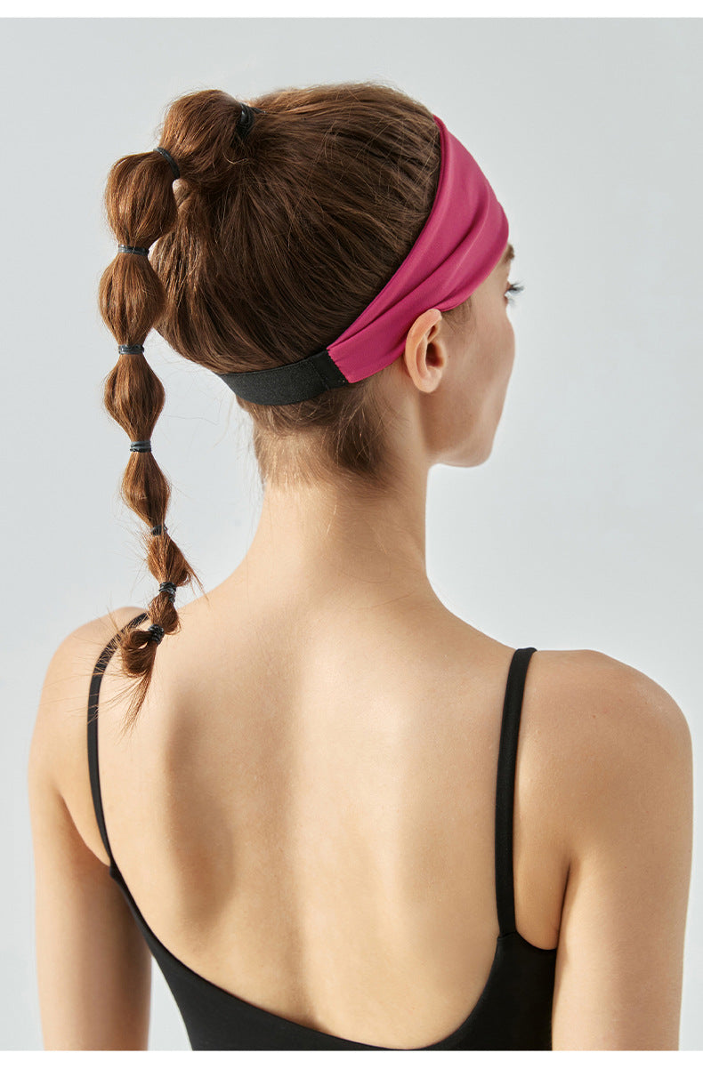 Back view of woman wearing cranberry headband with black elastic band.