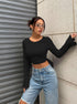 crop tops for women, black ribbed long sleeve, crew neck, bell sleeves, street style three-quarter pose