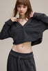 Dark gray cropped hoodie, front close view—clean front, drop shoulder.