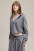 Light gray cropped hoodie, side view—relaxed fit, rib cuffs, clean zipless front.
