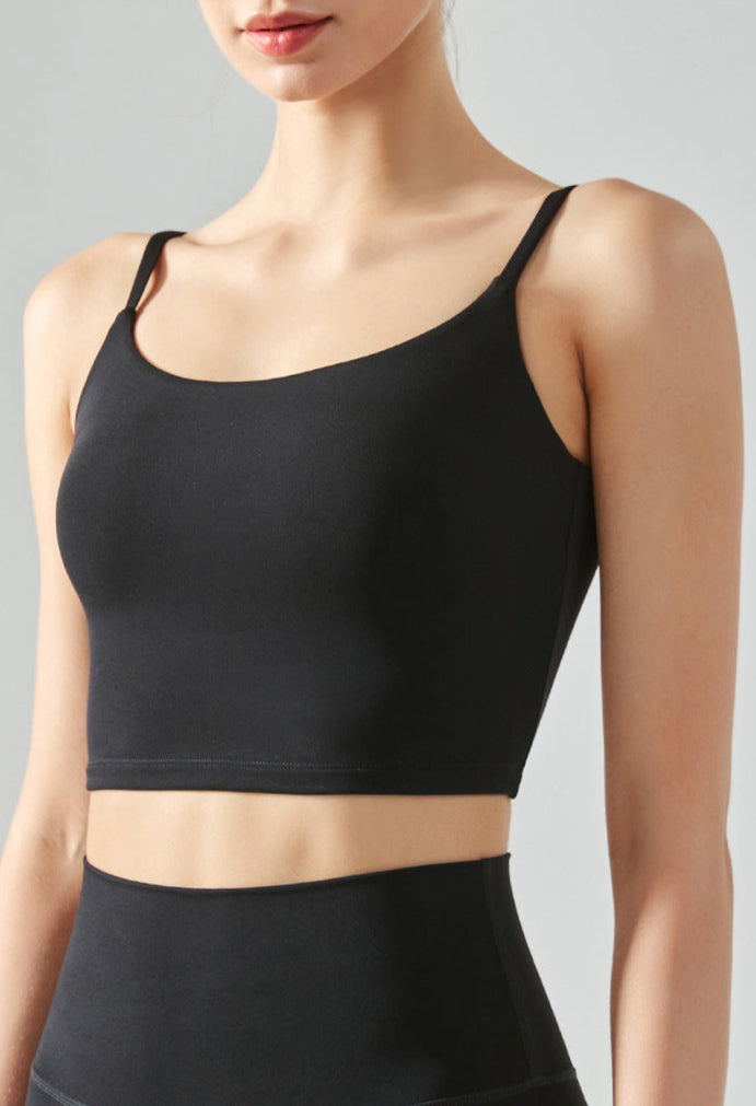 Cropped yoga tank top in black with square neck, open back, and removable chest pads
