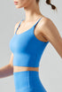 Blue cropped workout cami with scoop neckline and breathable Coolmax fabric, side view