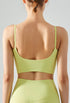 Back view of fall green cropped yoga top with scoop cut and thin straps