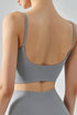 French gray seamless cropped tank top with cami straps and sculpting fit, back view.